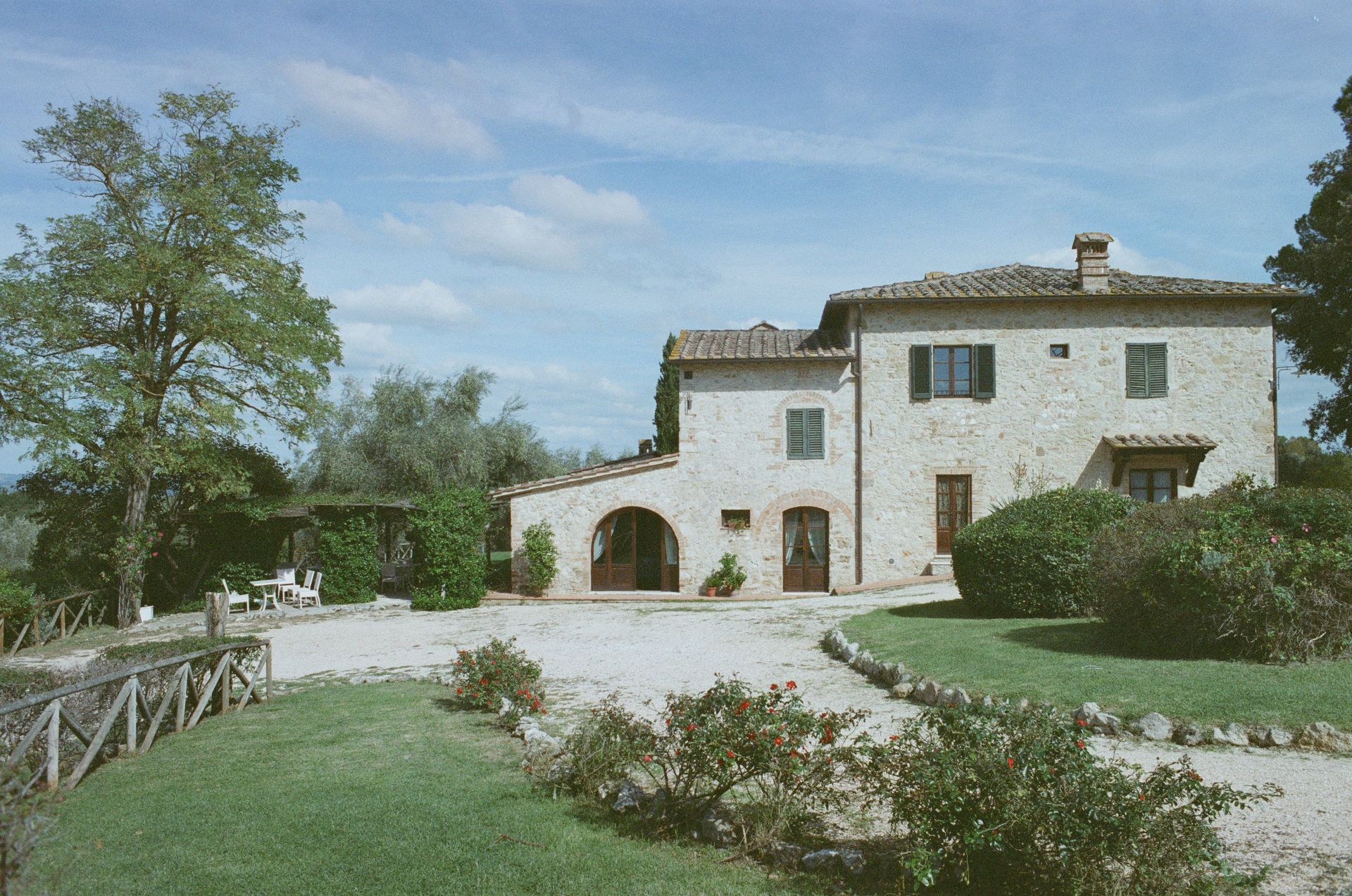 a large white house with a driveway